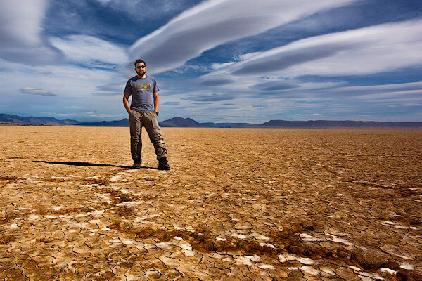 Adrian Klein standing on the dry Alvord Desert in Southeastern Oregon. Self portrait.