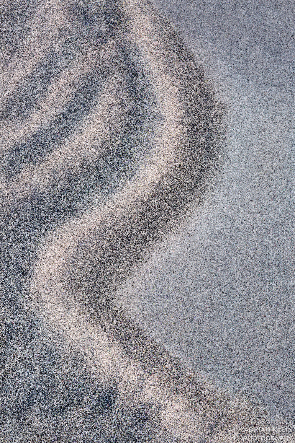 A close up scene of sand with the varying shades and lines. Along the Oregon Coast. Limited Edition of 50.