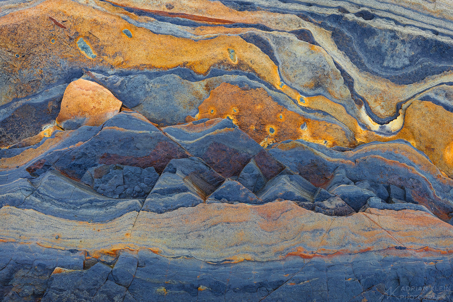 Layers of sandstone that resemble a mountain with a sunrise sky. Limited Edition of 100.