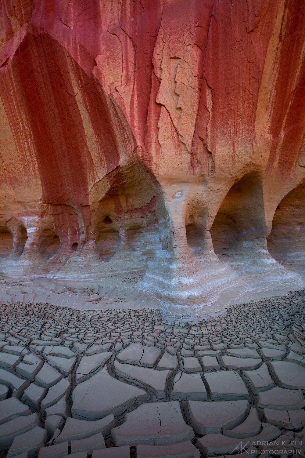 Canyon hiking on the Colorado Plateau in Utah with cracked mud ground and desert varnish dripping from the walls. Limited Edition...