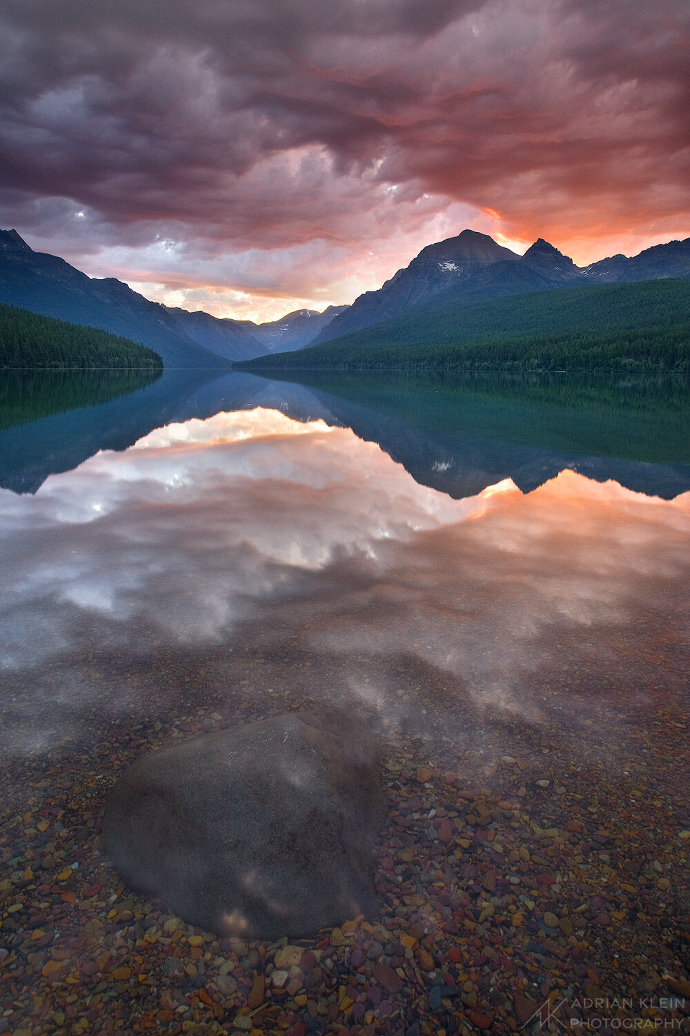 Storm clouds make for a sublime sunrise over Bowman Lake in Glacier National Park, Montana. Limited Edition of 50.