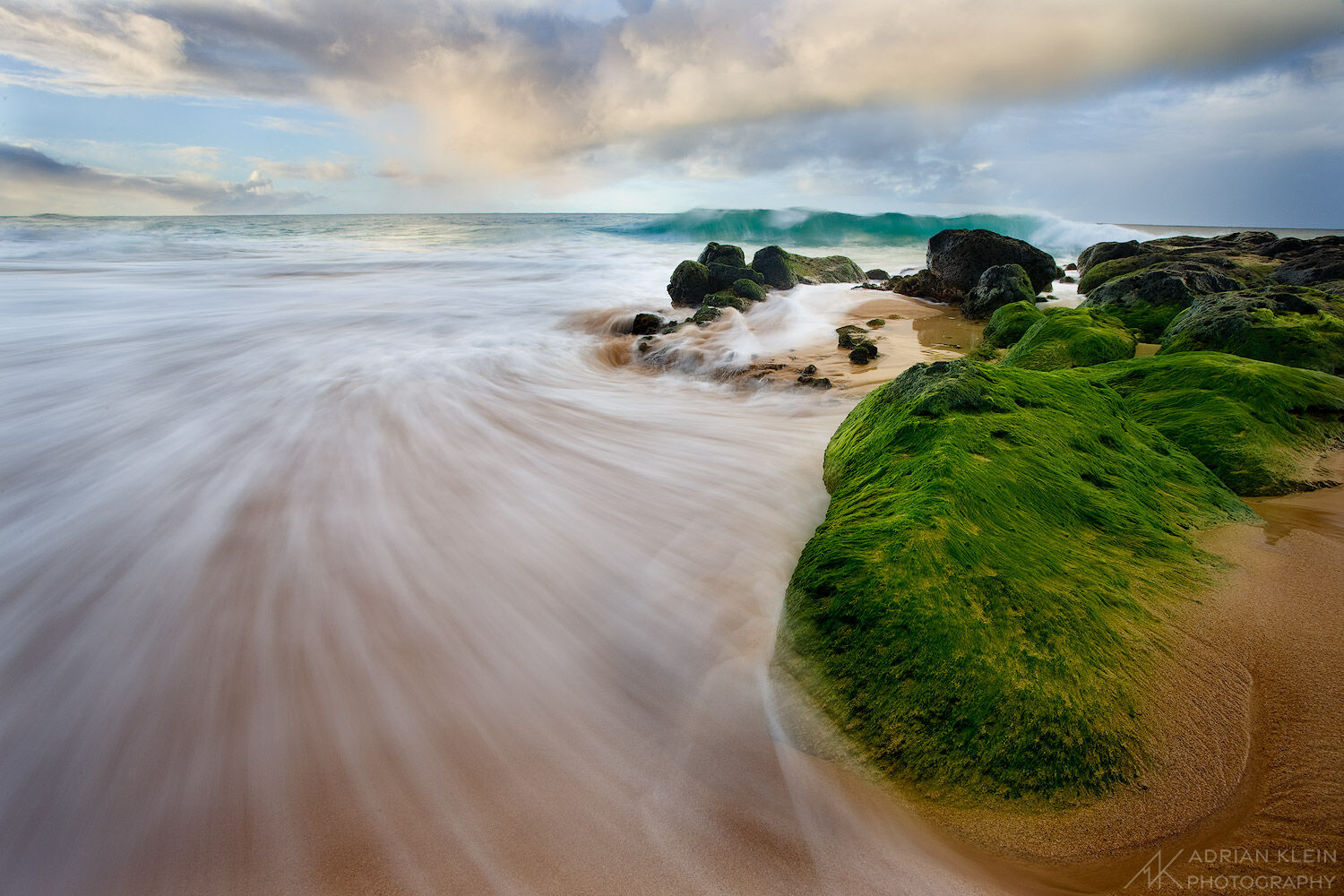 Waves coming right at me into the camera at sunset along the southeast shore of Kauai, Hawaii.