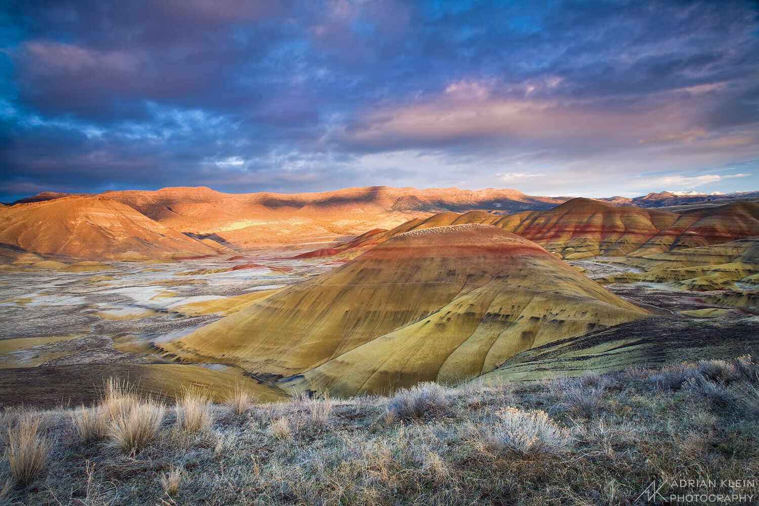 The Painted Hills National Monument comes alive at sunset during winter in Oregon. Limited Edition of 150.