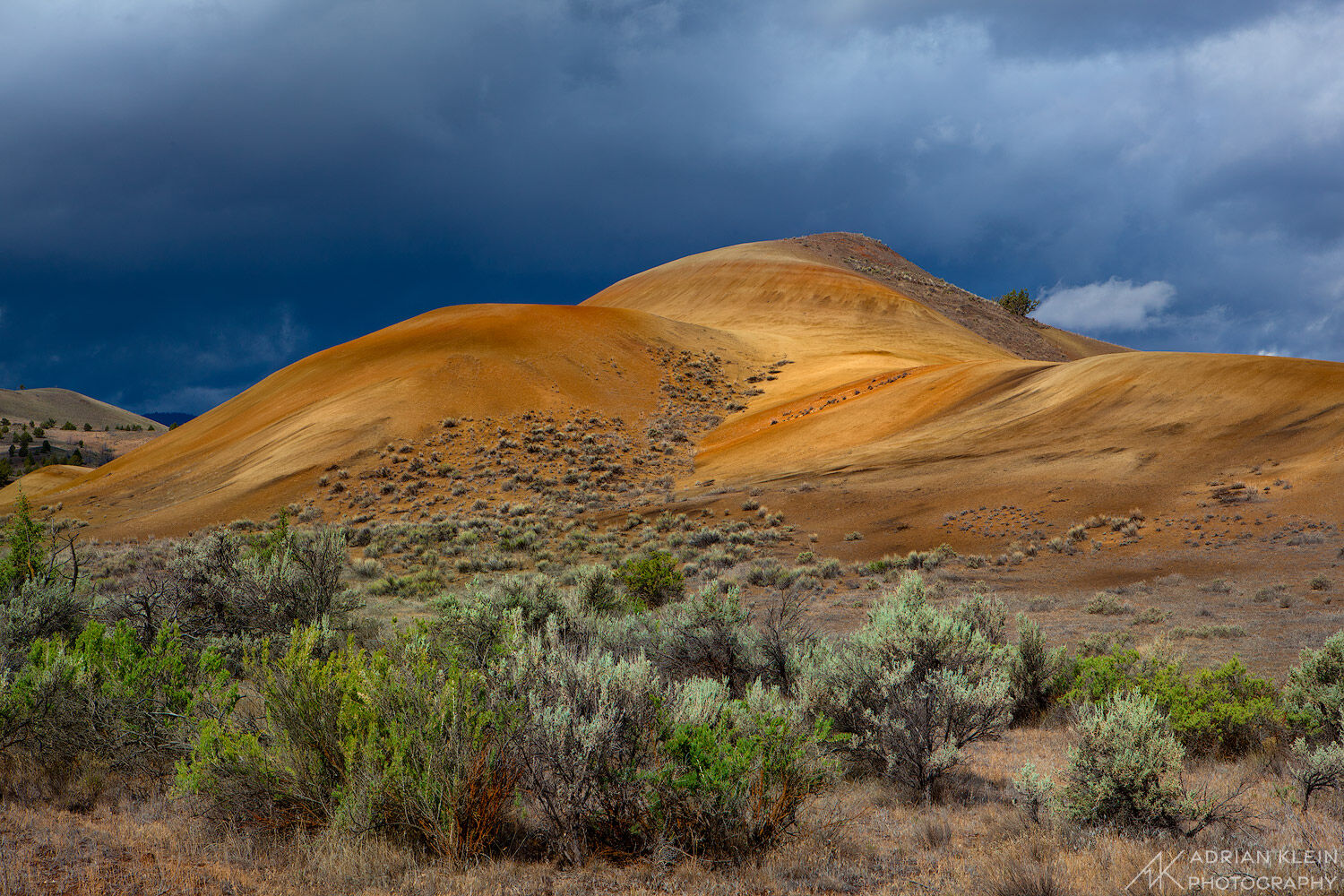 Hills in the area of Painted Hills Unit in central Oregon is lit up shortly after a passing storm.